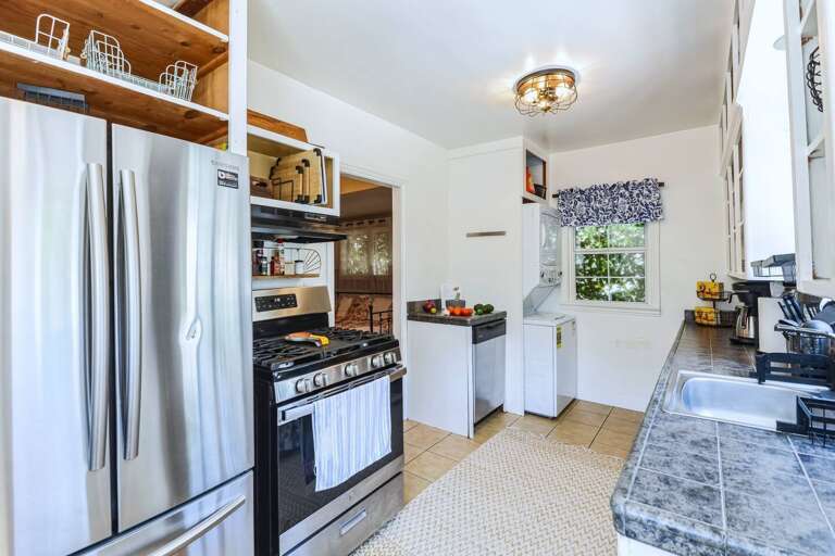 From every angle, our bright kitchen shines with a coffee station, Mexican hot cocoa, and all the essentials for festive meals. Plus, enjoy easy access to the backyard through the door, perfect for al fresco dining. From every angle, our bright kitchen shines with a coffee station, Mexican hot cocoa, and all the essentials for festive meals. Plus, enjoy easy access to the backyard through the door, perfect for al fresco dining.